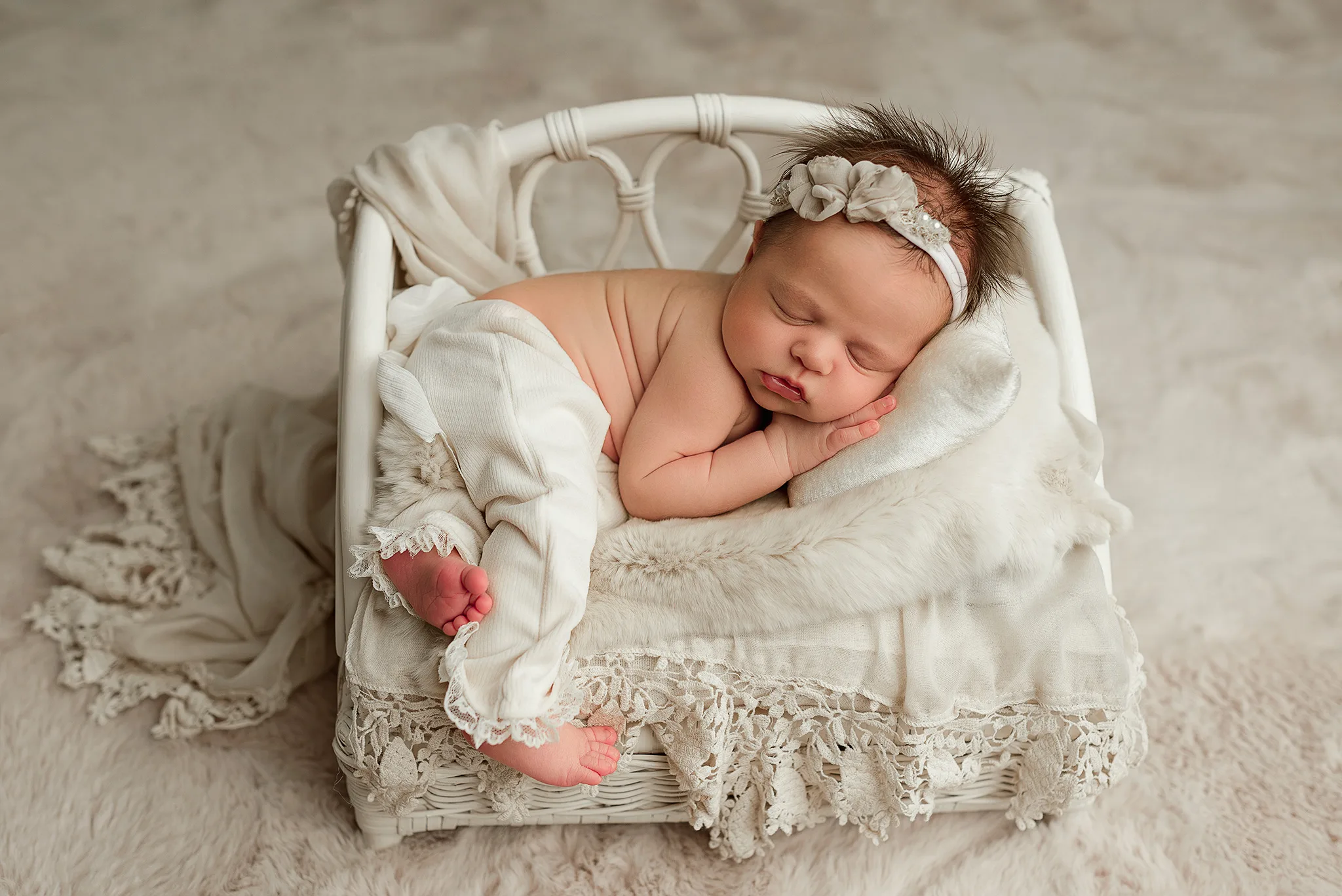 baby girl posed in newborn prop bed, photo studio lincoln nebraska, photographer photography, newborn photo, photo session, newborn photography lincoln ne