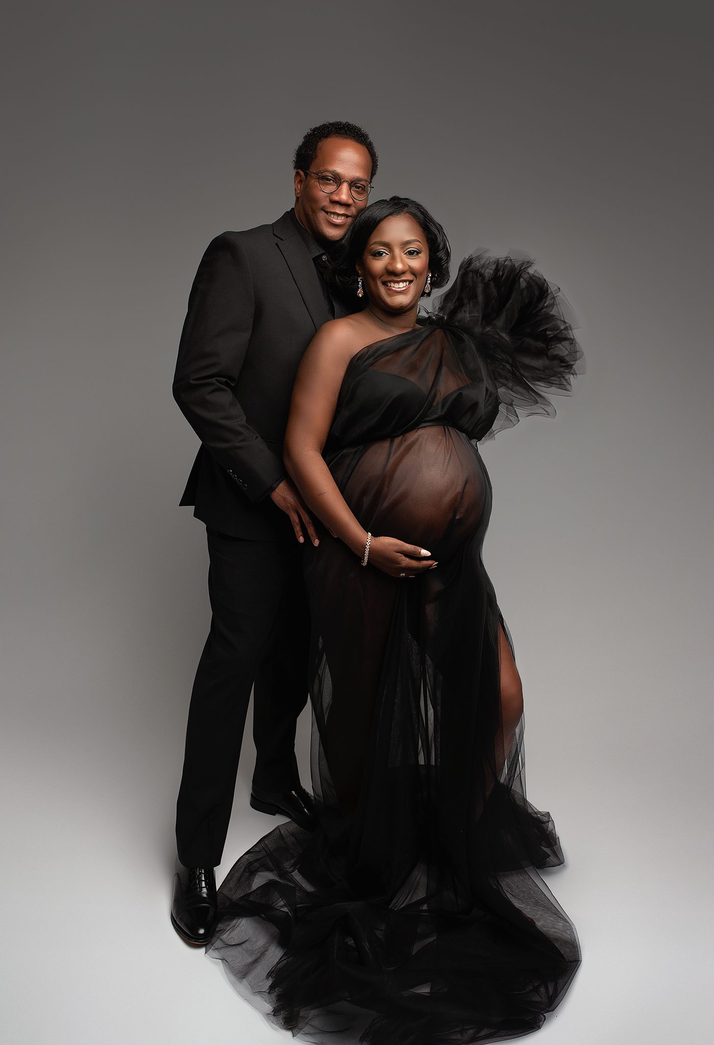 parents to be photographed in atlanta portrait studio to document their pregnancy. Dress provided by photographer in atlanta, simple maternity portraits, maternity photoshoot with couples