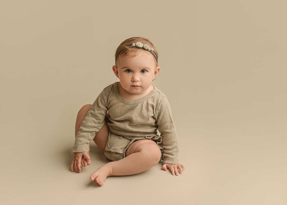 baby girl photographed in studio, baby girl with tieback, baby photography, atlanta portrait photographer, marietta baby photographer, milestone photography, first year milestone session, sitter session photography