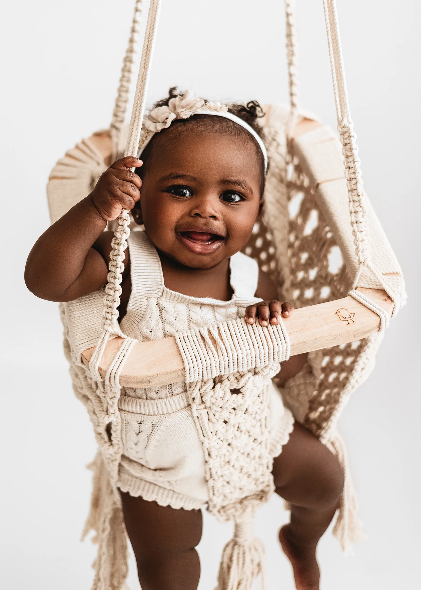 7 month old in swing for photoshoot, baby swing, smiling baby girl, tieback, cream baby set ups