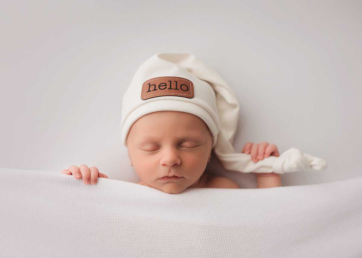 newborn-photographer-douglasville newborn baby boy photographed on white in a studio, posed newborn photographer, newborn photography douglasville ga, newborn photographer atlanta, studio newborn photographer douglasville, posed newborn photographer near me, newborn photographer near me, dallas ga newborn photography, newborn photography studios near me, newborn photoshoot prices, atlanta photographers