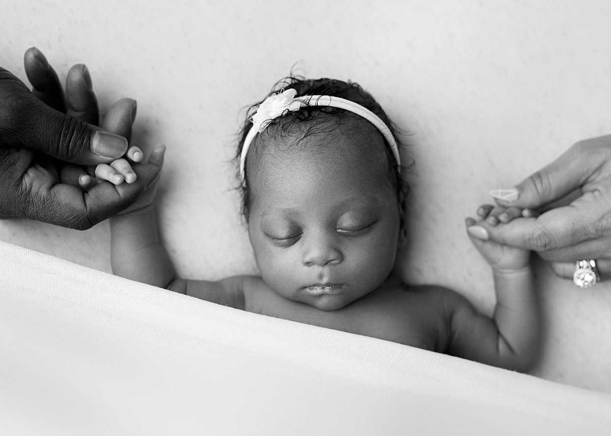 DSC_9411 black and white newborn portraits, georgia studio newborn photographer, best newborn photography georgia, newborn holding parents hands during photo session in Atlanta georgia