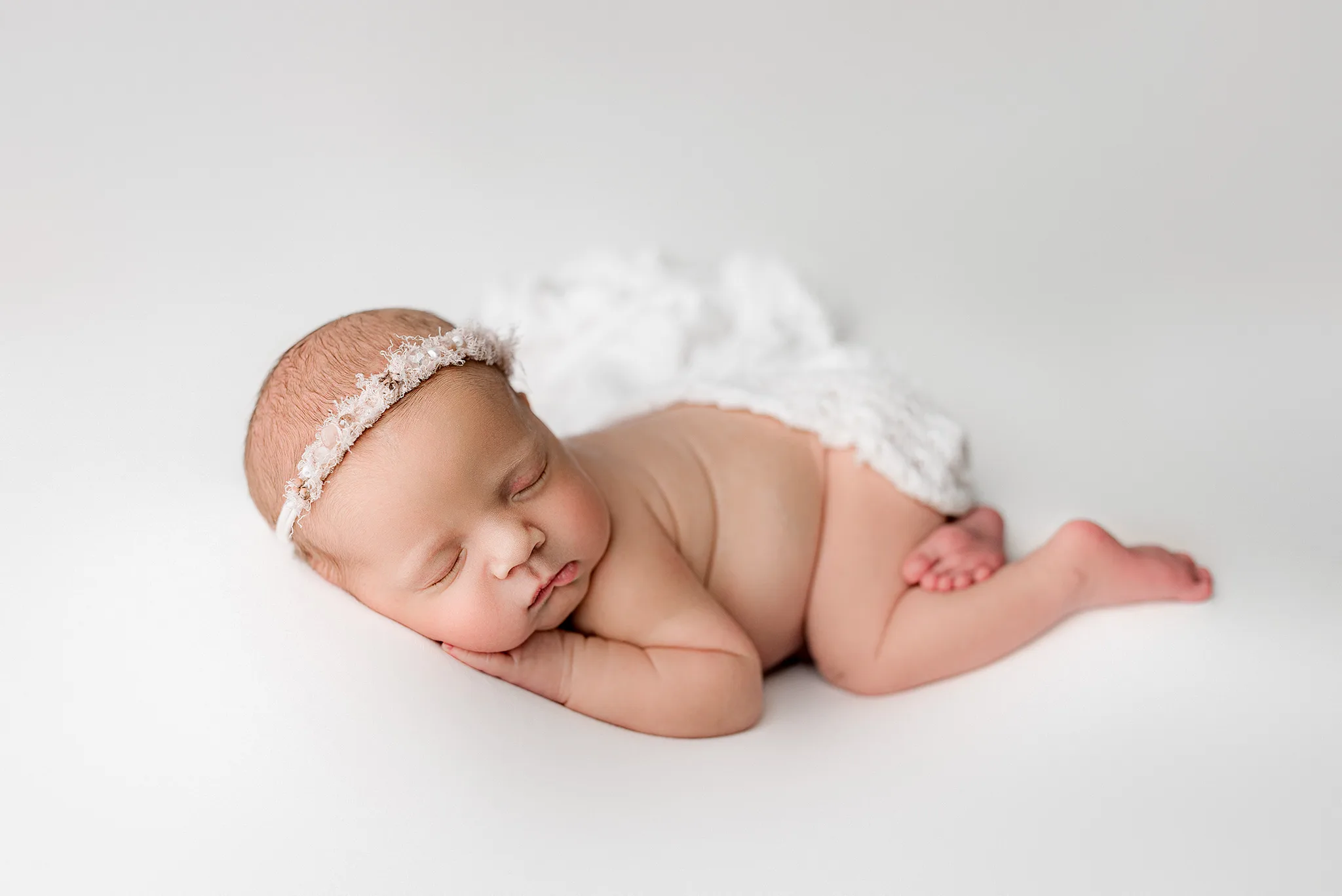 new born photography atlanta, baby portraits atlanta, baby photographer atlanta, baby girl posed on simple studio backdrop, atlanta photographer with props, simple and timeless newborn photography