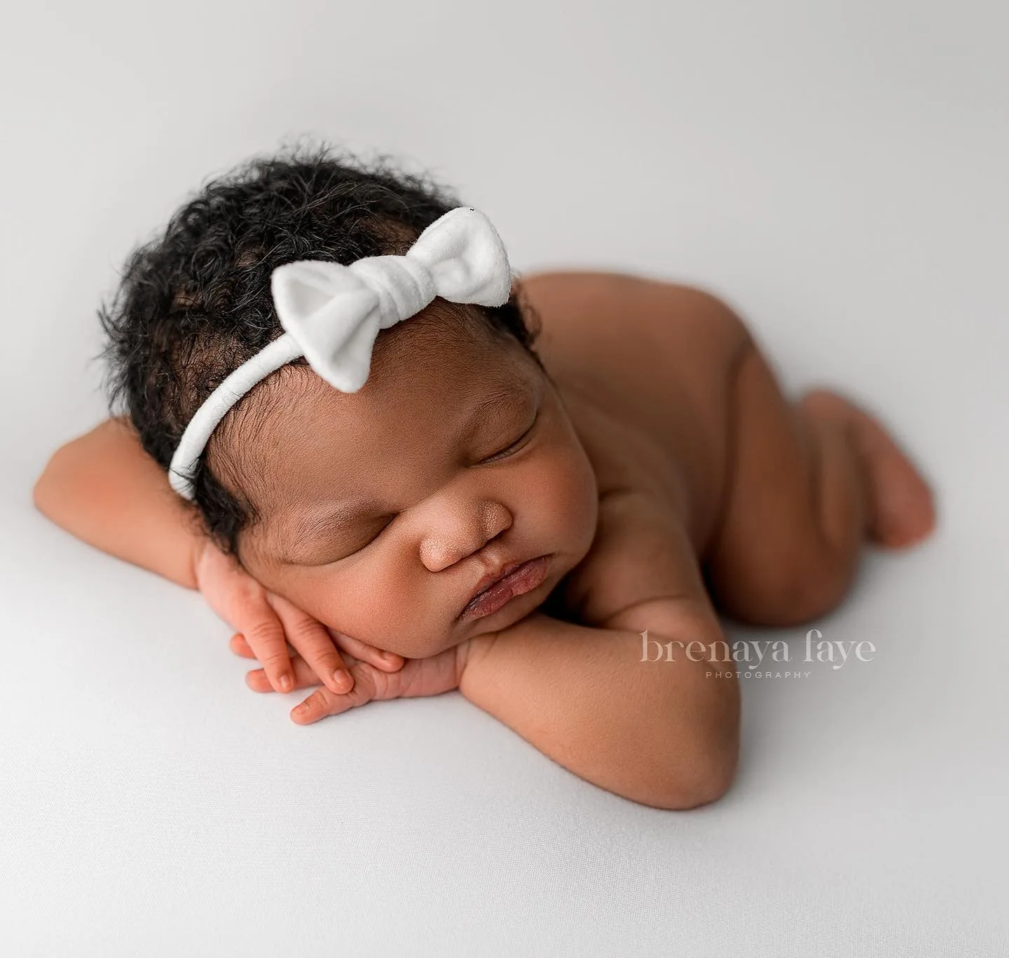 Luxury posed newborn portrait in client’s home