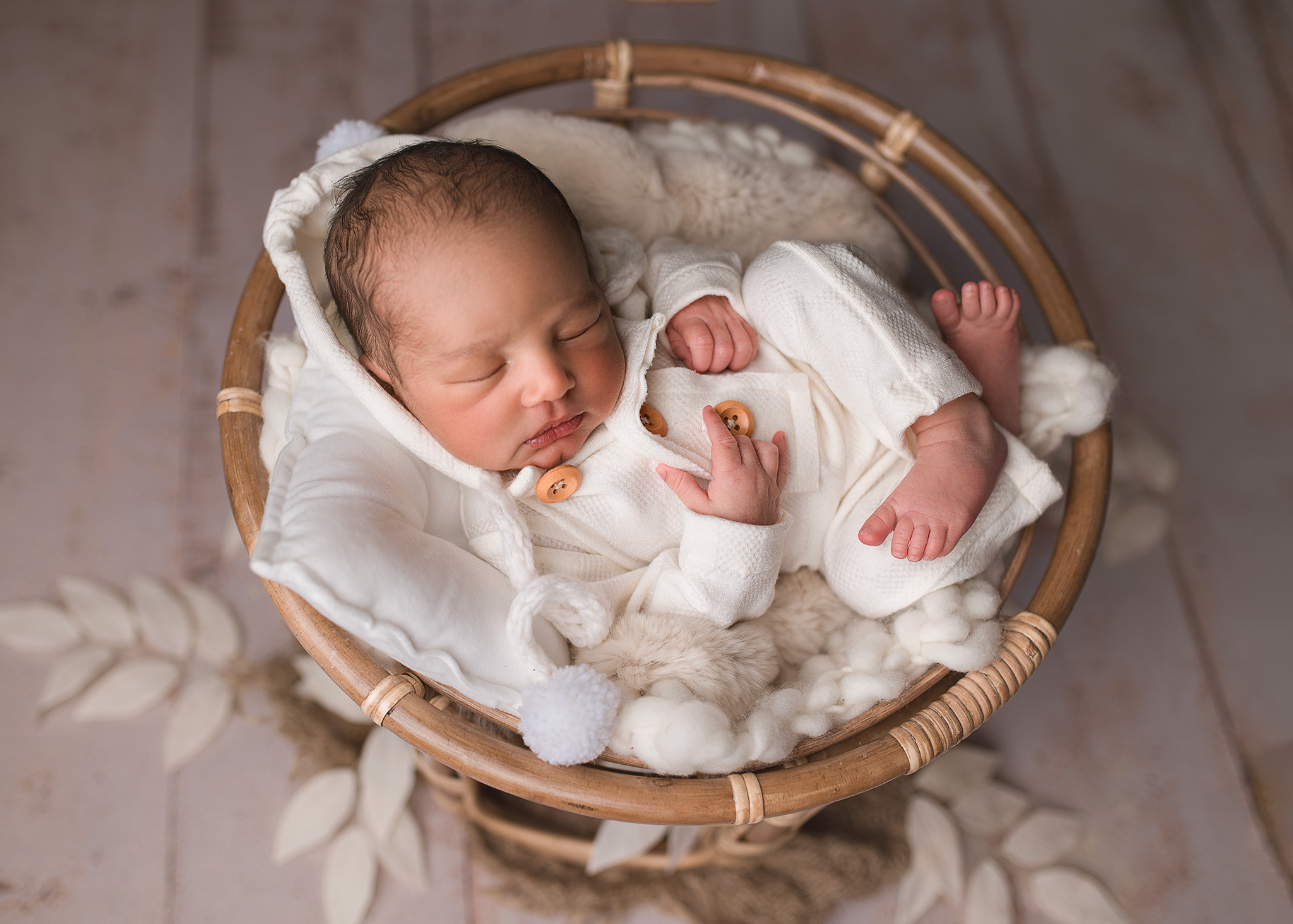 newborn baby boy posed in papasan chair, infant photography, lincoln nebraska photographer, newborn photographer with studio