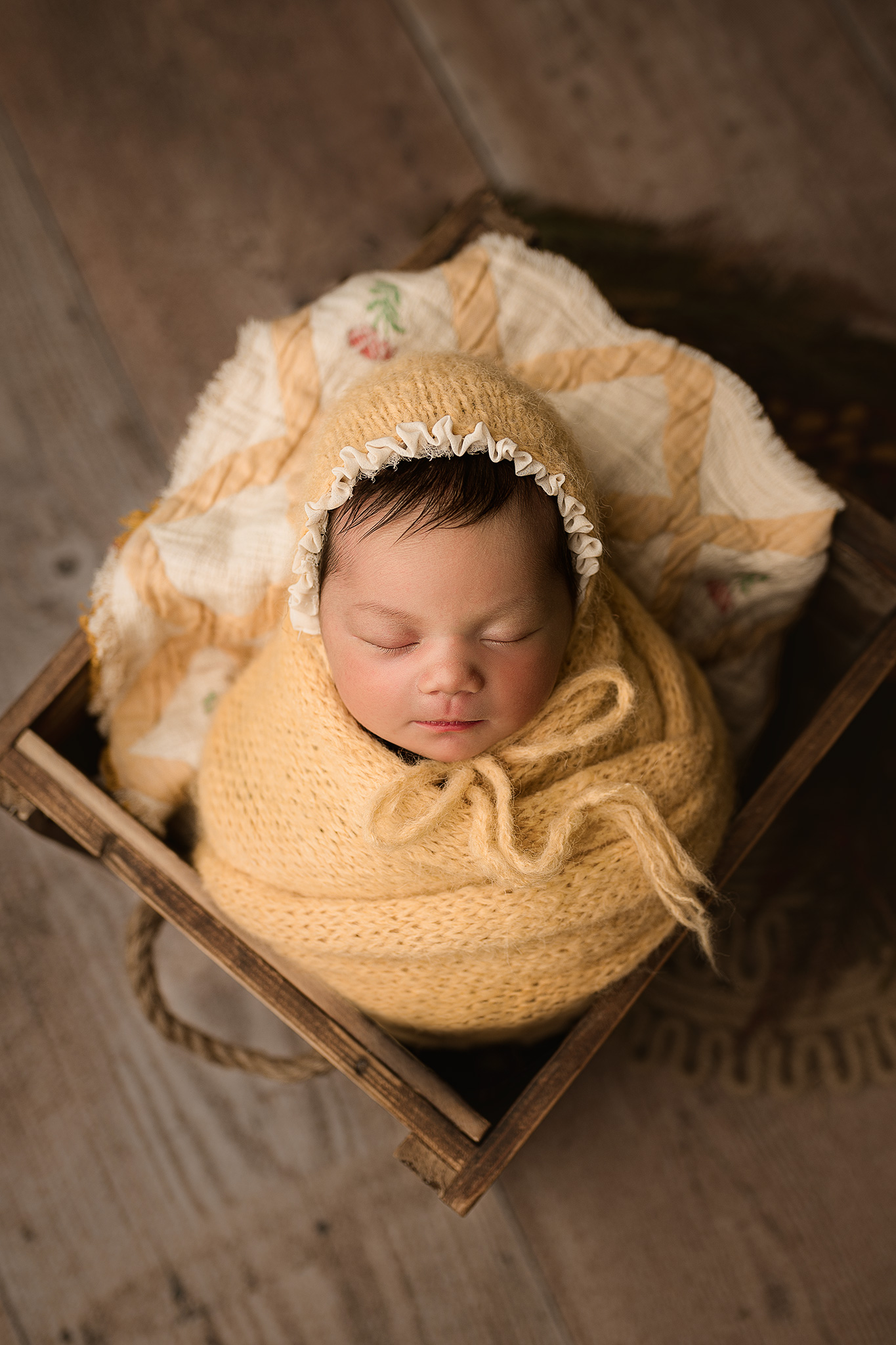 newborn girl posed in yellow for newborn photography session, best newborn photographer in nebraska, newborn photography lincoln ne