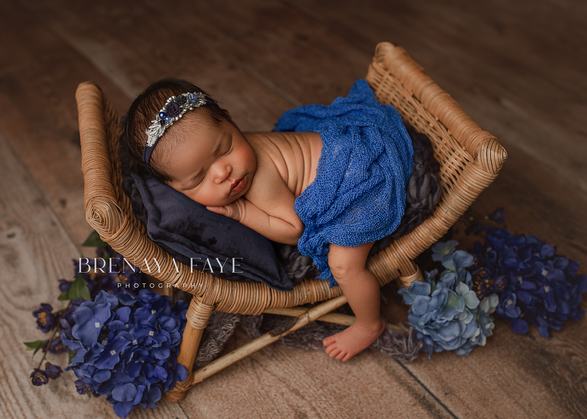 baby posed on prop for newborn photography session, baby girl in blue, newborn photo ideas using blue