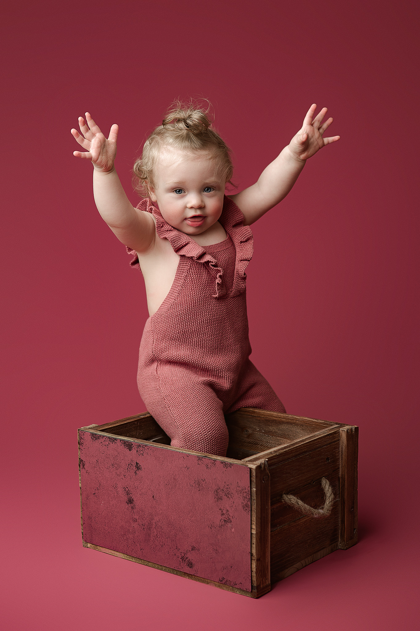 baby girl photographed in pink in a home in indiana