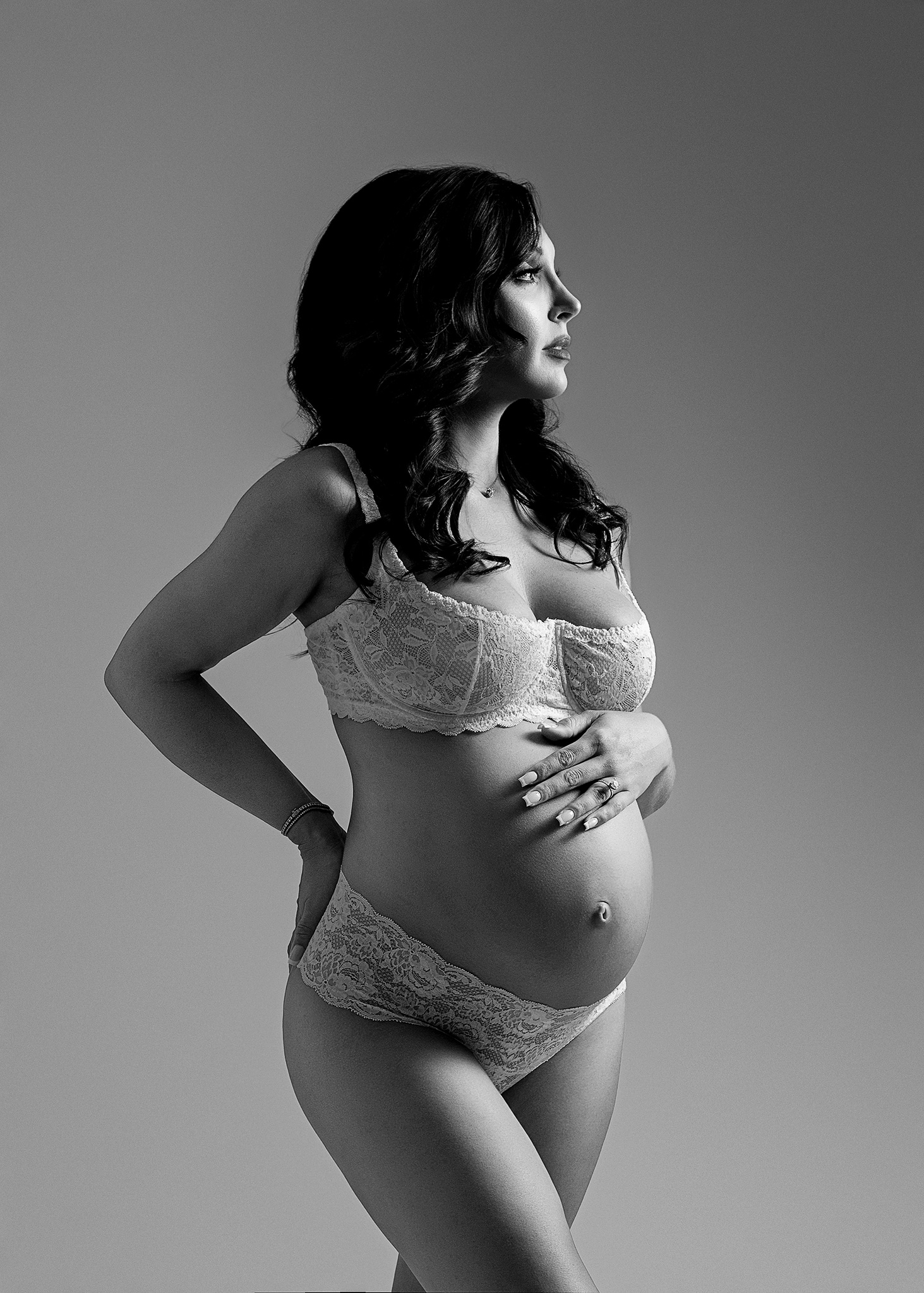 fine art maternity west lafayette indiana, mom to be photographed in bralette during photo session