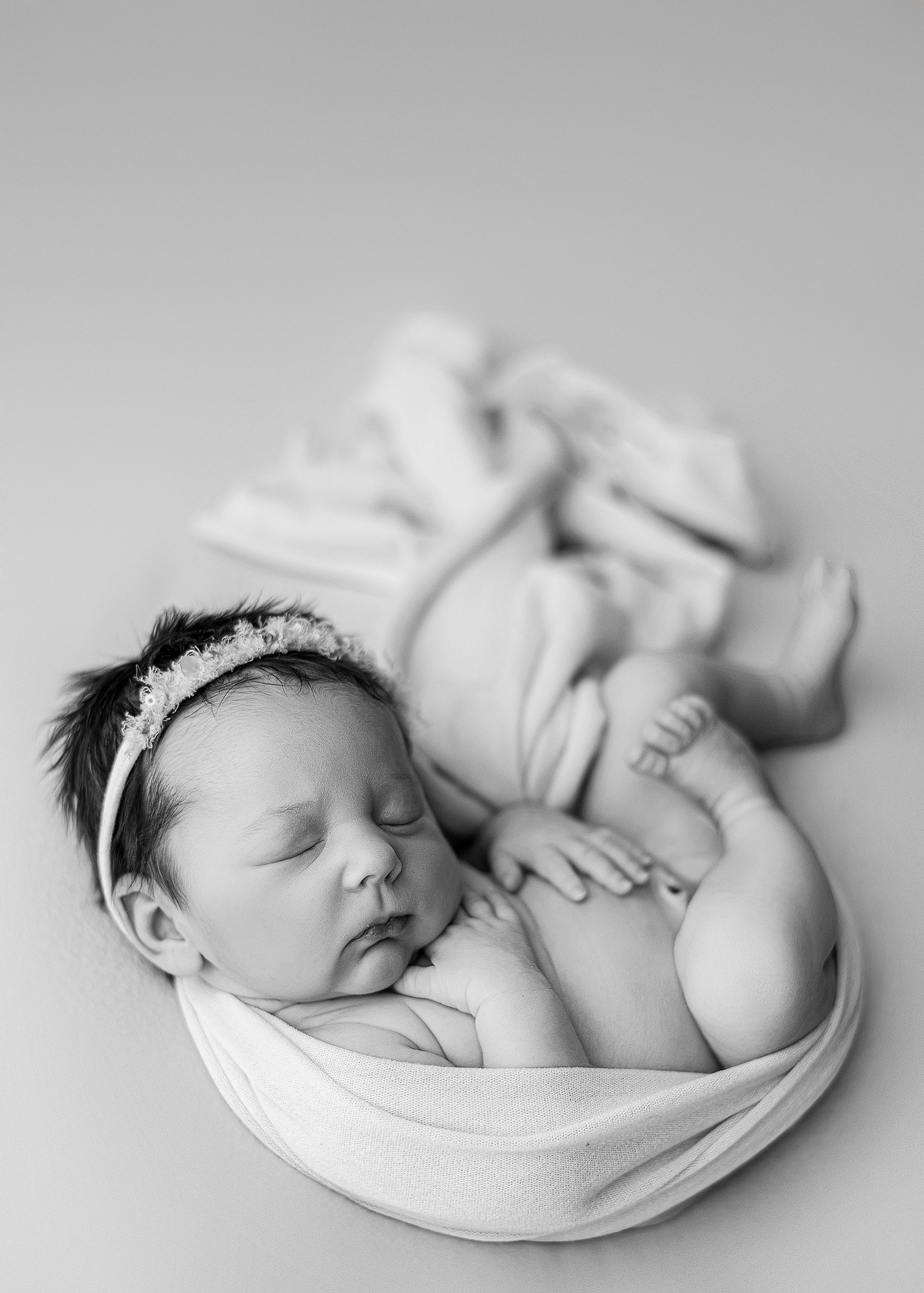 newbornphotographywestlafayetteBW newborn babygirl photographed in a portrait studio using timeless colors and expert posing.