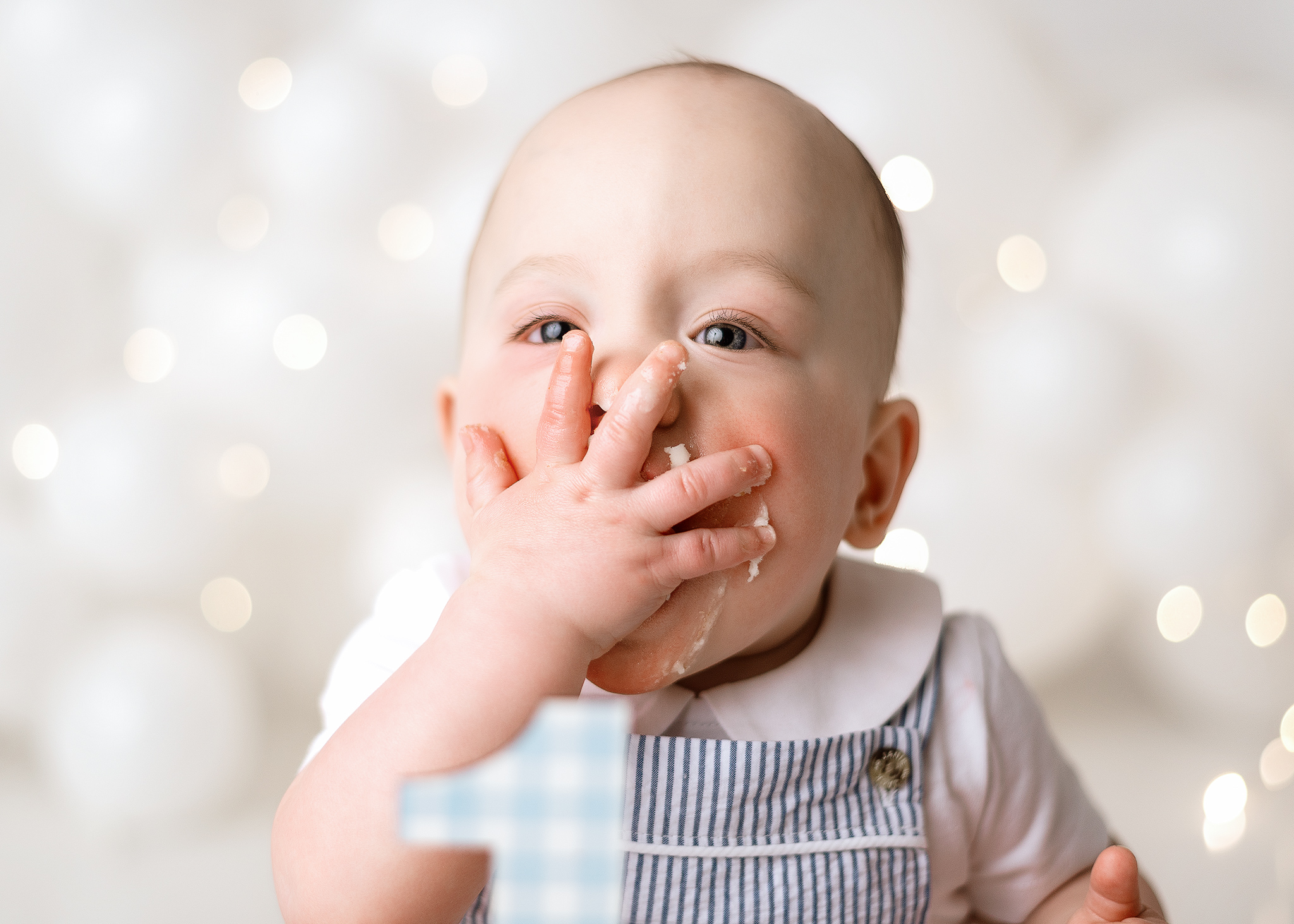 twin boy smashing cake in home session indiana