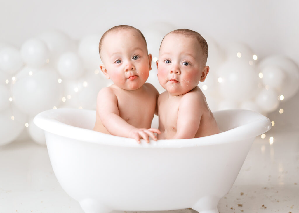 twin boys in a baby bath after their cake smash session done in lafayette Indiana