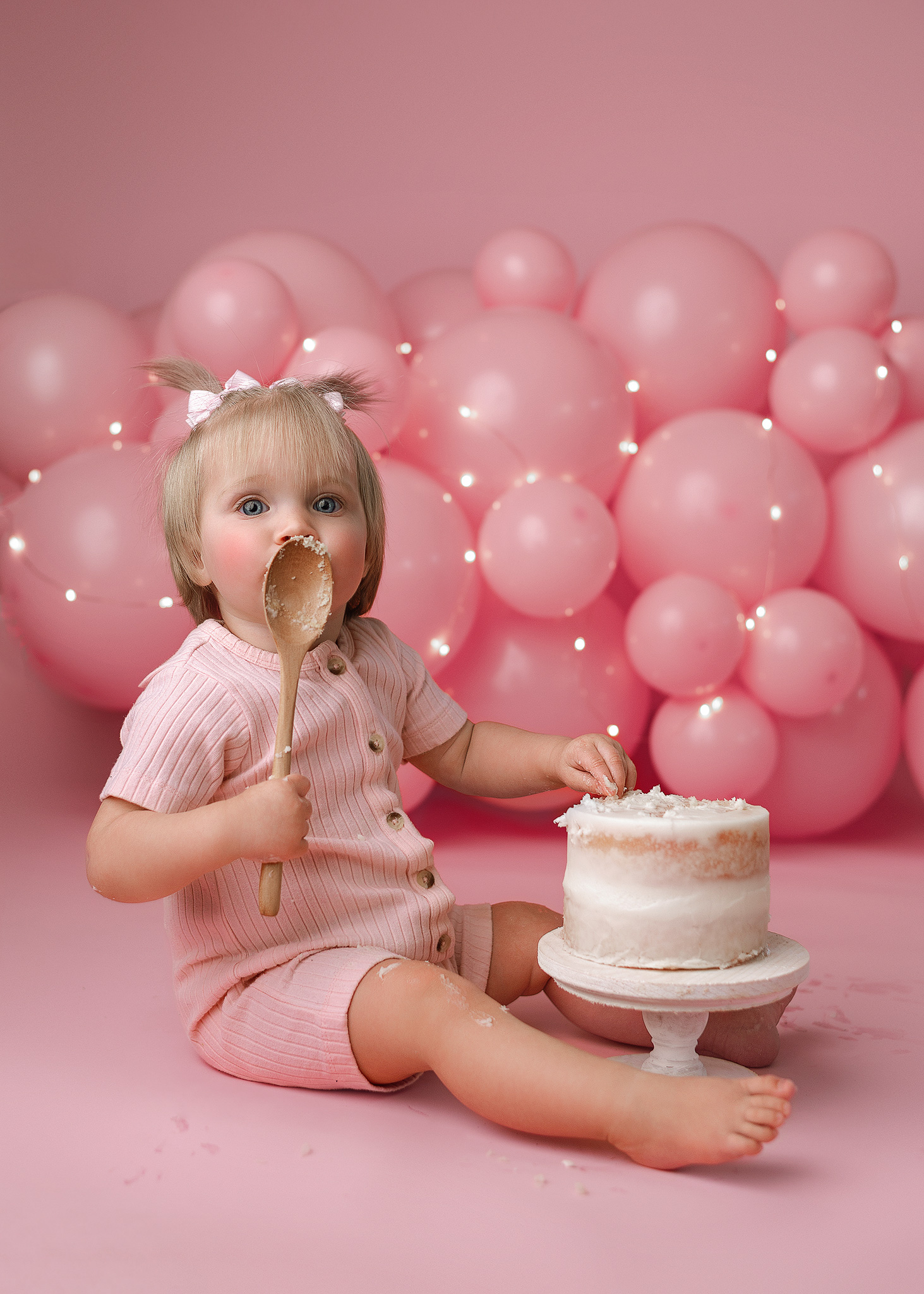 baby first birthday photoshoot in lafayette indiana home using pink for the color