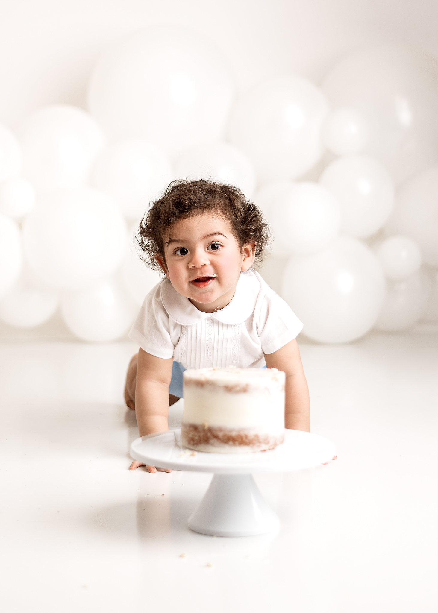 simple white cake smash using white background done in home in west lafayette indiana