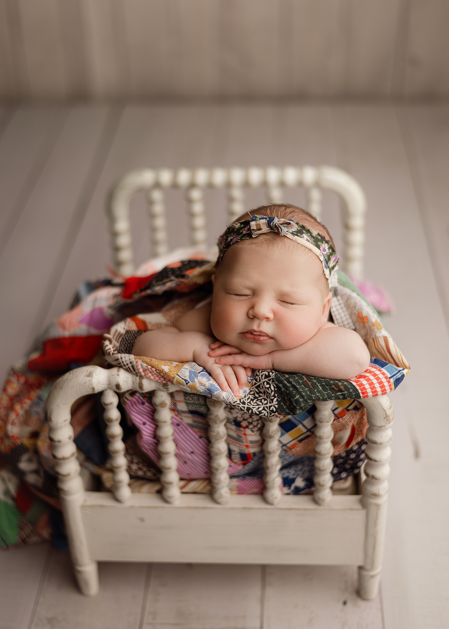 BFP_0015 Newborn baby girl posed on prop during newborn photography session