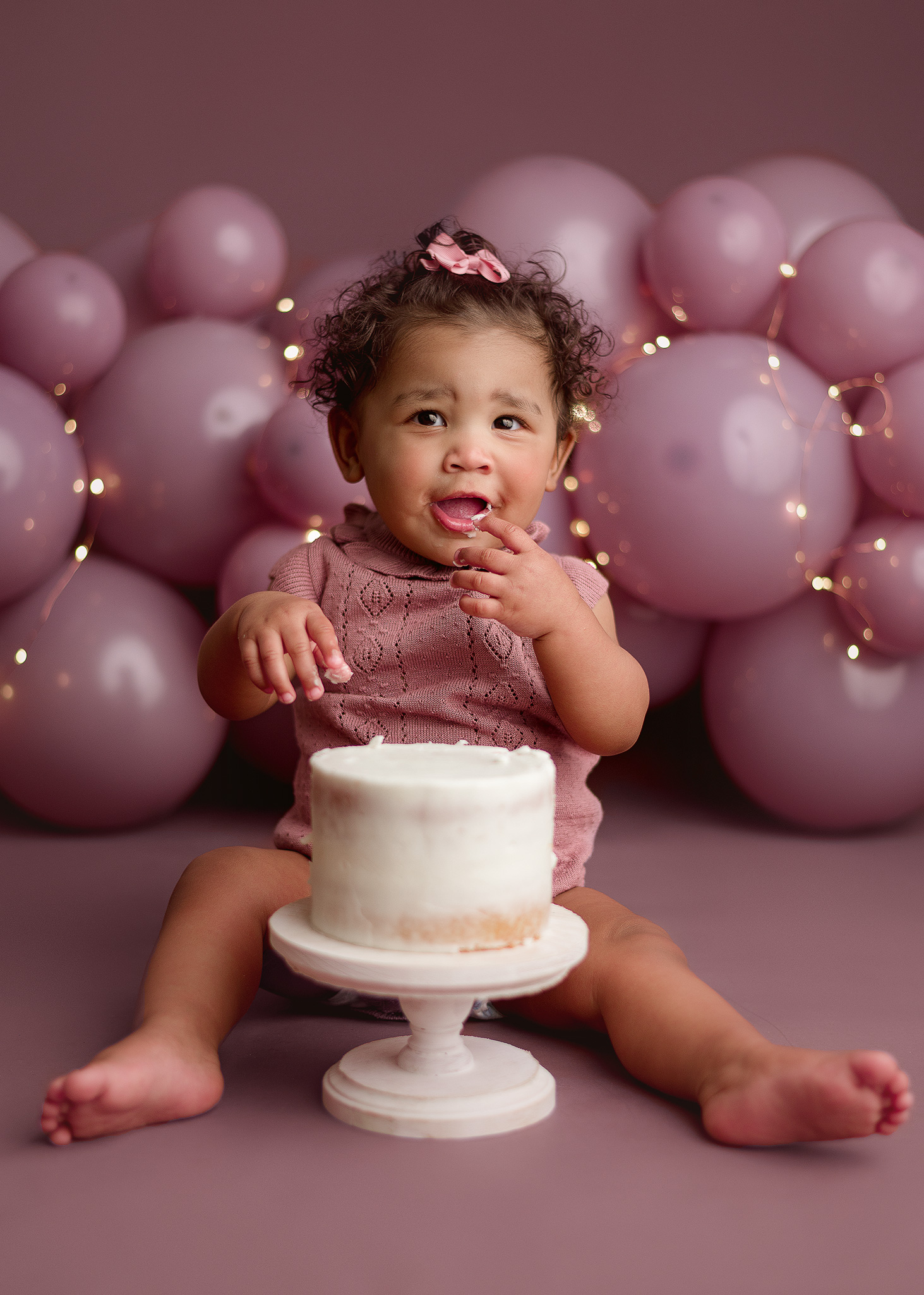 baby girl purple cake smash portrait