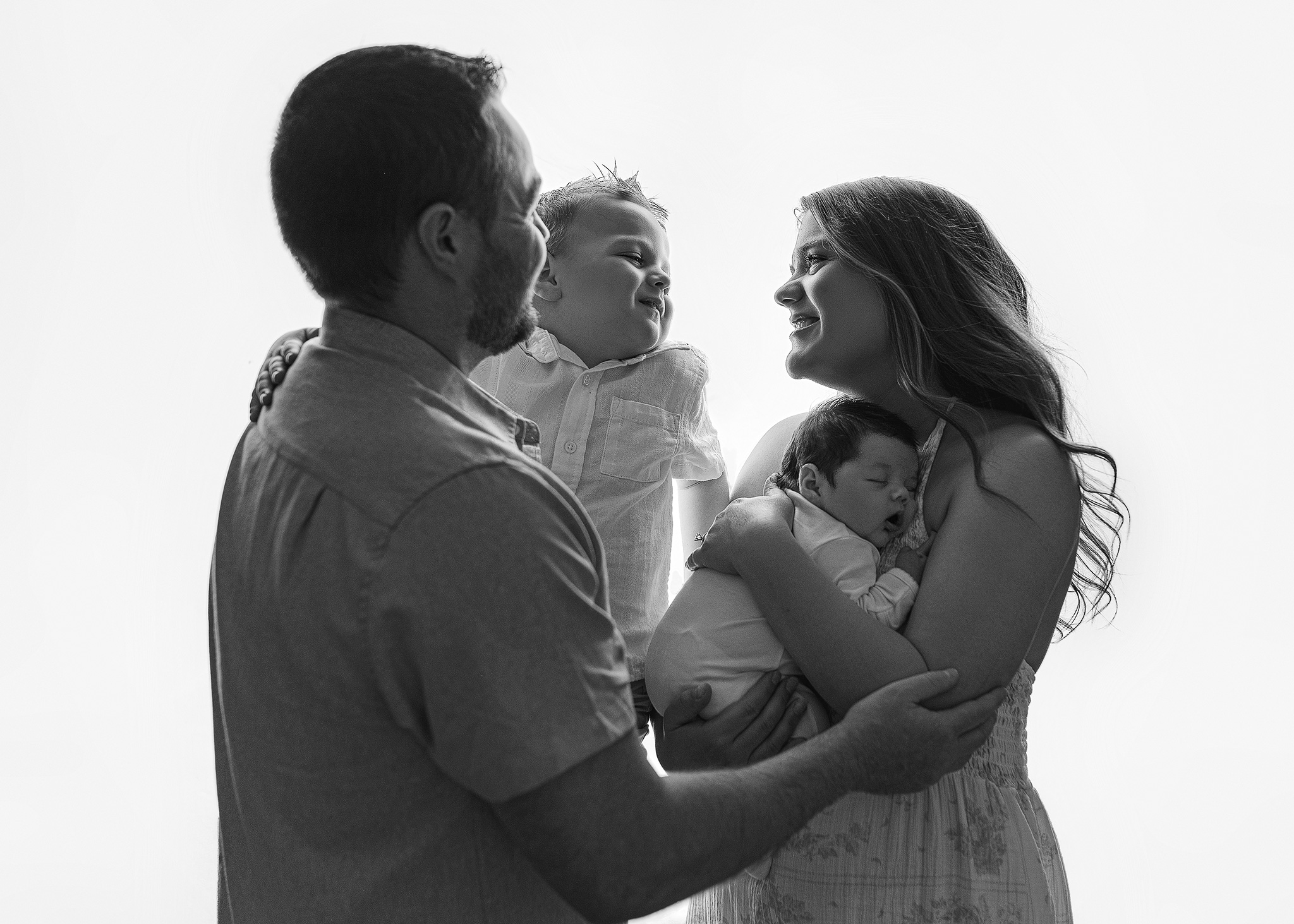 family and newborn portrait photographed at home
