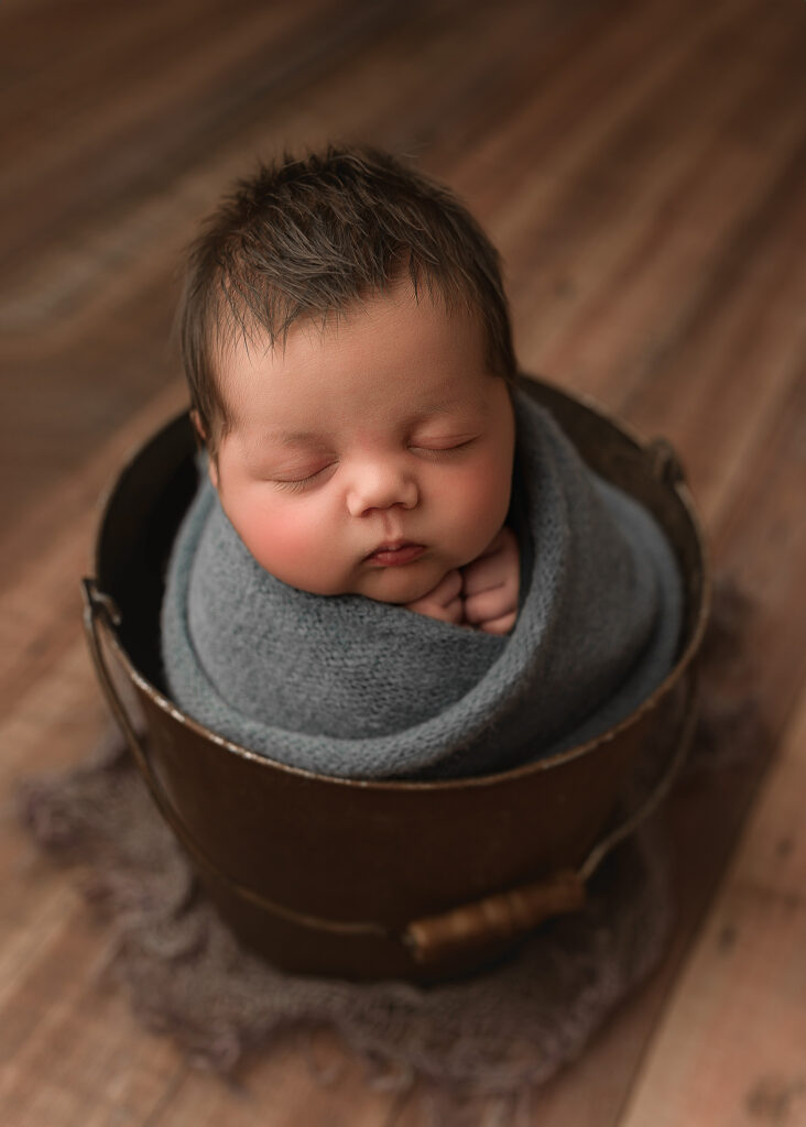 Studio style newborn portrait photographed inside the family's home