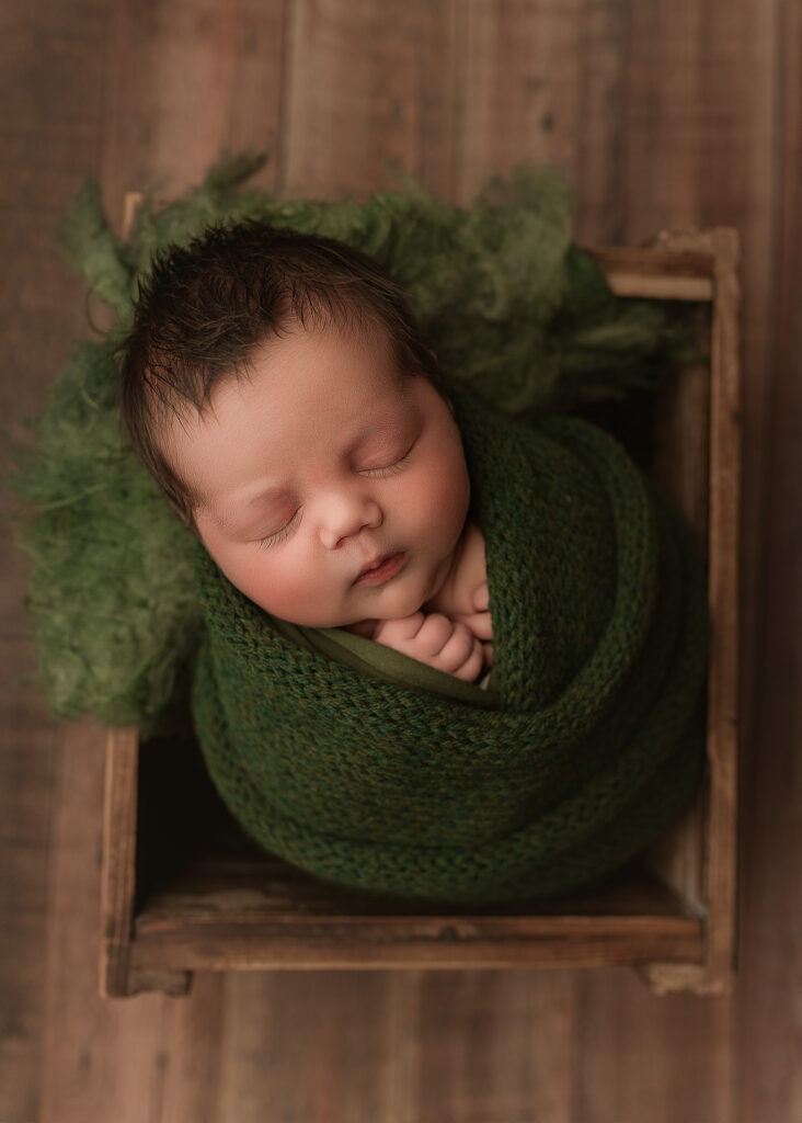 Newborn baby boy photographed during an in home newborn session in Indianapolis