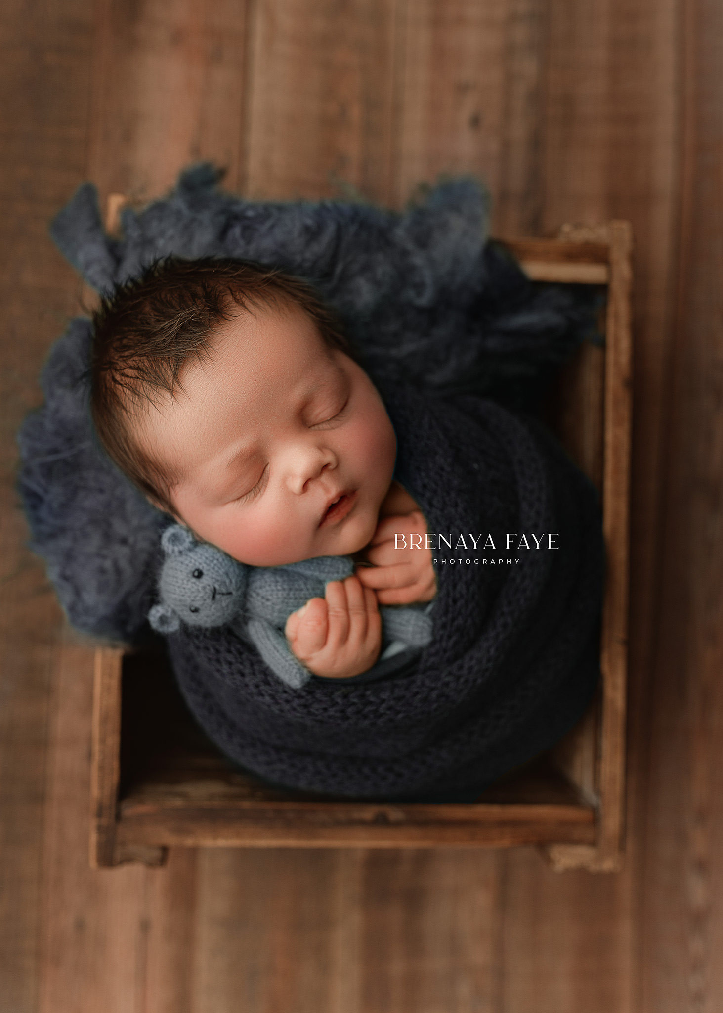 newborn posed in prop during newborn photoshoot in Indianapolis home, indianapolis newborn photographer