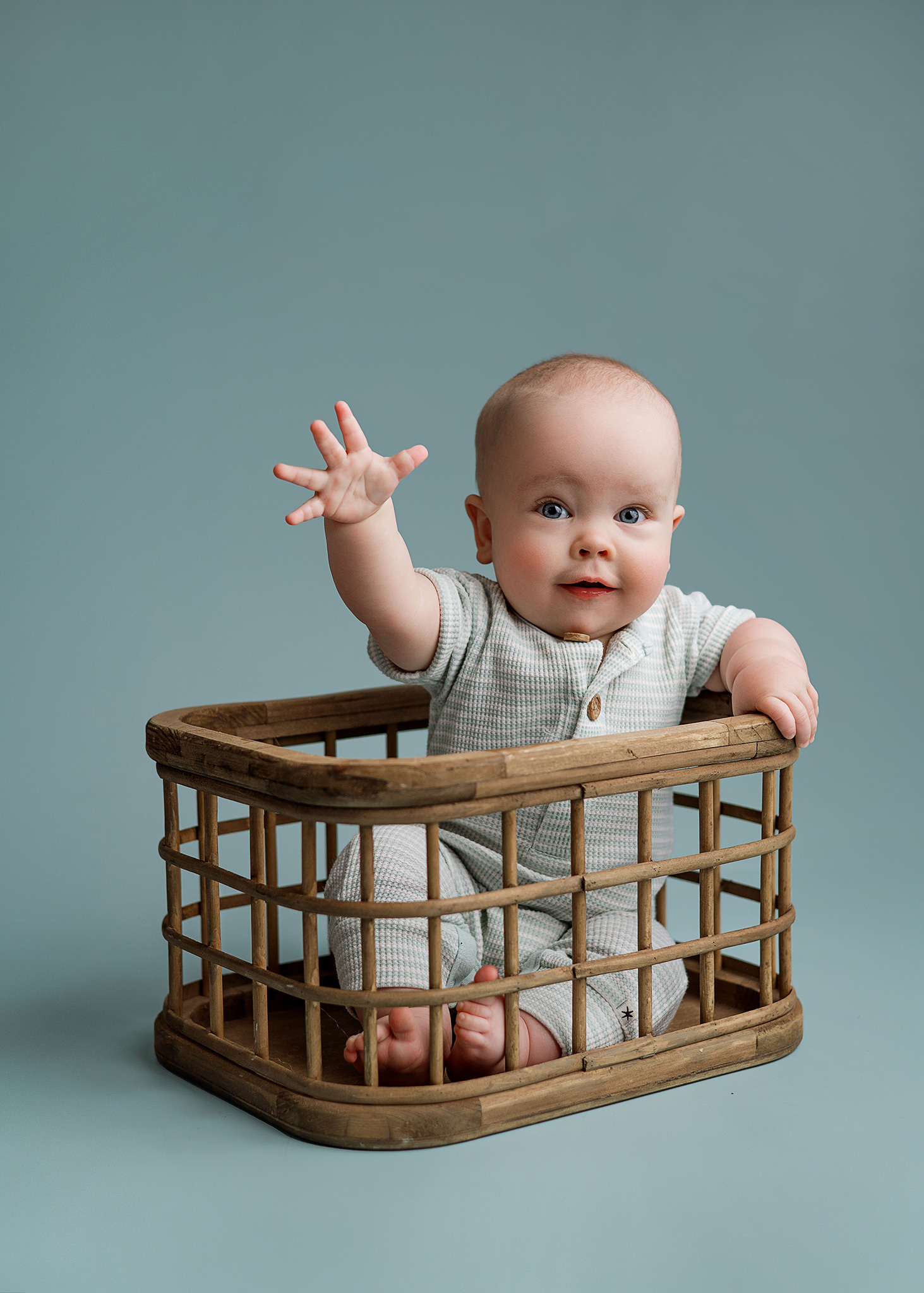 Classic baby boy milestone photography with a professional studio setup brought to the family's home