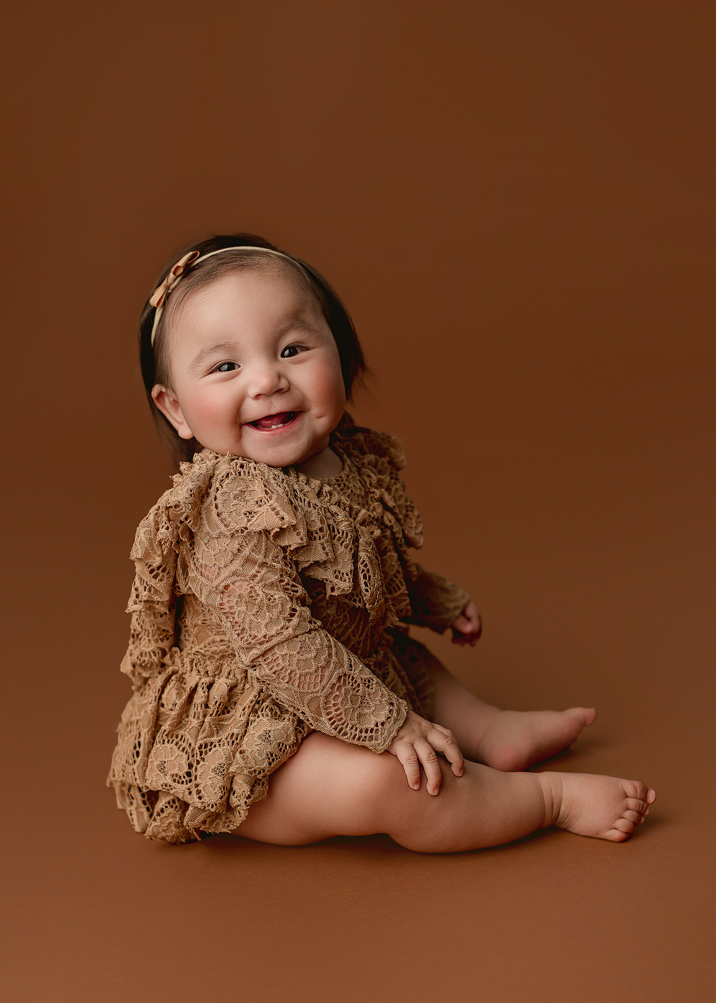 Baby girl milestone portraits by an Indianapolis in-home baby photographer
